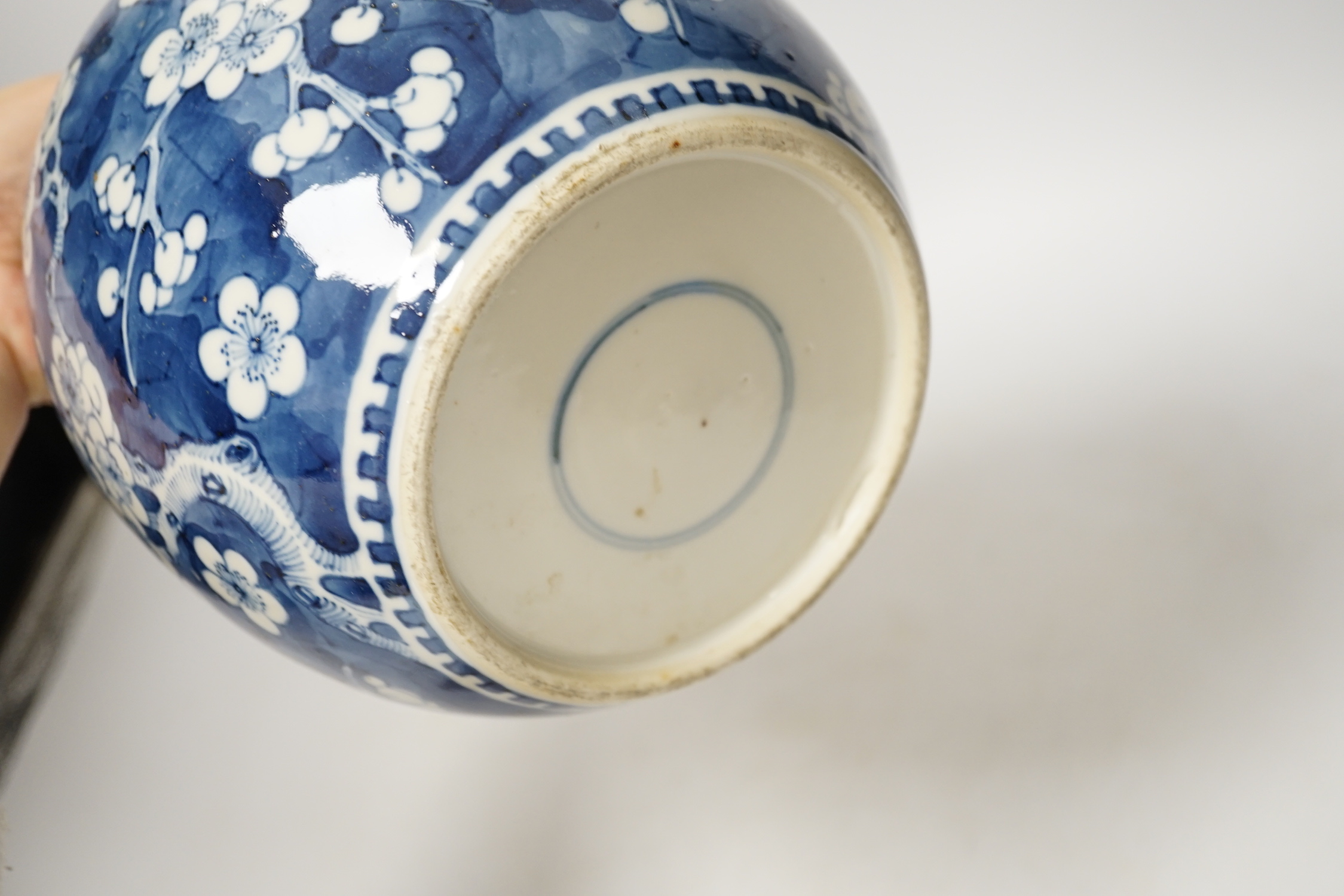 A 19th century Chinese blue and white prunus jar and cover, together with two similar tiles, jar 21cm